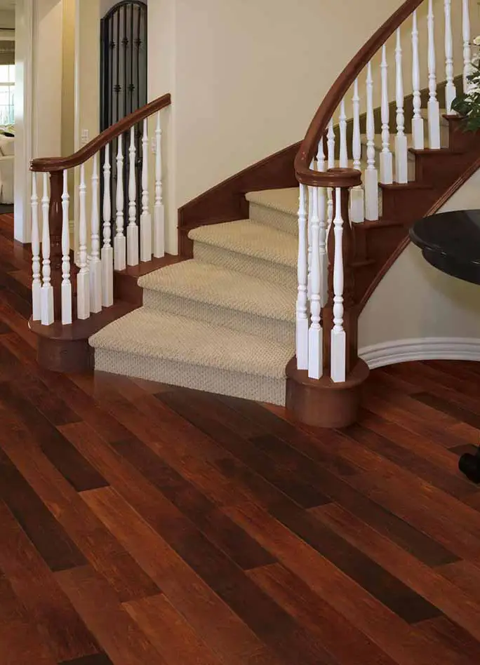 a wood staircase with a railing